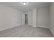 Bright bedroom with carpeted floors and access to hallway at 811 Pryor St, Mebane, NC 27302