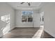 Bright bedroom with hardwood floors and large window at 811 Pryor St, Mebane, NC 27302