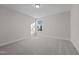 Spacious bedroom with neutral carpeting and large window at 811 Pryor St, Mebane, NC 27302