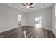 Bright bedroom with wood-look floors and access to bathroom at 811 Pryor St, Mebane, NC 27302