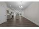 Open concept dining room and kitchen with hardwood floors at 811 Pryor St, Mebane, NC 27302
