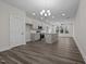 Open concept dining room with hardwood floors and kitchen island at 811 Pryor St, Mebane, NC 27302