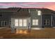 Rear view of house at night with sunroom and patio at 811 Pryor St, Mebane, NC 27302
