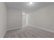 Bright hallway with carpeted floor and access to other rooms at 811 Pryor St, Mebane, NC 27302