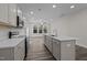 Modern kitchen with gray cabinets, quartz countertops, and stainless steel appliances at 811 Pryor St, Mebane, NC 27302