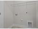 Laundry room with shelving and space for washer and dryer at 811 Pryor St, Mebane, NC 27302