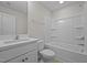 Clean bathroom with single vanity and bathtub at 813 Pryor St, Mebane, NC 27302
