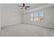 Spacious bedroom with carpeted floors and large window at 813 Pryor St, Mebane, NC 27302
