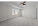 Bright bedroom featuring ceiling fan and ample closet space at 813 Pryor St, Mebane, NC 27302