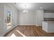Bright dining area with hardwood floors and access to a patio at 813 Pryor St, Mebane, NC 27302