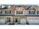 Attractive townhome with light beige and gray siding, and a 2 car garage at 813 Pryor St, Mebane, NC 27302