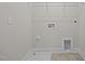 Laundry room with utility hookups and shelving at 813 Pryor St, Mebane, NC 27302