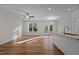 Sunlit living room featuring hardwood floors and access to back patio at 813 Pryor St, Mebane, NC 27302
