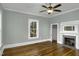 Bedroom features a fireplace, natural light, and access to a walk-in closet at 915 S 3Rd St, Sanford, NC 27330