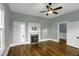 Bedroom featuring a classic fireplace with a white mantel and hardwood floors at 915 S 3Rd St, Sanford, NC 27330