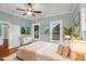 Staged bedroom with a neutral color scheme, bright windows, and hardwood flooring at 915 S 3Rd St, Sanford, NC 27330