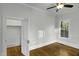 Bright bedroom with wood floors, ceiling fan, and ample natural light from the window at 915 S 3Rd St, Sanford, NC 27330