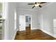 Bright bedroom featuring hardwood floors, white trim, and natural light at 915 S 3Rd St, Sanford, NC 27330