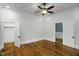 Bright bedroom features hardwood floors and access to a walk-in closet at 915 S 3Rd St, Sanford, NC 27330