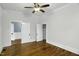 Bedroom with hardwood floors and access to an ensuite bath and closet at 915 S 3Rd St, Sanford, NC 27330