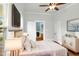 Bright staged bedroom showcasing a neutral color palette, hardwood floors, and modern décor at 915 S 3Rd St, Sanford, NC 27330