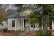 Charming home featuring a blue metal roof, classic columns, and potential for renovation at 915 S 3Rd St, Sanford, NC 27330
