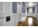 Hallway featuring a traditional-style doors, trim, and gorgeous hardwood flooring at 915 S 3Rd St, Sanford, NC 27330