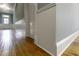Hallway with beautiful hardwood floors and classic beadboard wainscoting at 915 S 3Rd St, Sanford, NC 27330