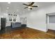 Spacious room showcases the kitchen with white cabinetry, stainless steel refrigerator and blue island at 915 S 3Rd St, Sanford, NC 27330