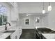 Kitchen with granite countertops, stainless steel appliances, and open doorway to the backyard at 915 S 3Rd St, Sanford, NC 27330