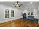 Bright, open kitchen featuring white cabinetry, stainless steel appliances, and a stylish blue island at 915 S 3Rd St, Sanford, NC 27330