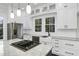 Kitchen with granite counters, stainless steel refrigerator, white cabinets and a large island at 915 S 3Rd St, Sanford, NC 27330