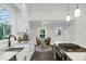 Kitchen featuring granite countertops, stainless steel appliances, and an open doorway to the dining area at 915 S 3Rd St, Sanford, NC 27330