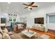 A spacious living room with wood flooring and a view of the kitchen and dining area at 915 S 3Rd St, Sanford, NC 27330