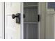 White shelving provides organized storage space behind an opened door with a vintage knob at 915 S 3Rd St, Sanford, NC 27330