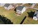 A stunning aerial view showcases the home's spacious backyard and inviting wooden deck at 251 Meadow Hills Dr, Four Oaks, NC 27524
