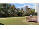An inviting backyard view, featuring an expansive lawn and beautiful wooden deck for relaxation at 251 Meadow Hills Dr, Four Oaks, NC 27524