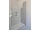 Contemporary bathroom with a gray tiled shower and a built-in niche at 3341 Colby Chase Dr, Apex, NC 27539