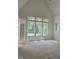 Bright bedroom featuring large windows and a high ceiling at 3341 Colby Chase Dr, Apex, NC 27539