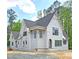 Charming two-story home with brick and vinyl siding and multiple windows under construction at 3341 Colby Chase Dr, Apex, NC 27539