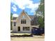 Charming two-story home with neutral colored brick and ample windows under a blue sky at 3341 Colby Chase Dr, Apex, NC 27539