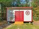 White and red storage shed with double doors at 4118 Trotter Ridge Rd, Durham, NC 27707