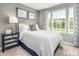 Bedroom with striped bedding and a mirrored nightstand at 2103 Pitchfork Ln, Durham, NC 27713