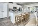 Modern kitchen with white cabinets, granite countertops, and an island at 2103 Pitchfork Ln, Durham, NC 27713