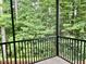 Enjoy the outdoors bug free in this screened porch overlooking lush greenery and a forest at 430 Easy Wind Ln, Garner, NC 27529