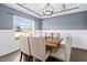 Formal dining room with a rustic wood table and six chairs at 52 Reserve Dr, Fuquay Varina, NC 27526