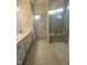 Bathroom boasts double vanity, large shower, and tile flooring at 55 Sawtooth Oak Ln, Youngsville, NC 27596