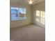 Spacious bedroom with carpeted floors and a large window at 55 Sawtooth Oak Ln, Youngsville, NC 27596