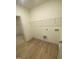 Laundry room includes built-in shelving and flooring at 55 Sawtooth Oak Ln, Youngsville, NC 27596