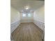 Home office with hardwood floors and wainscoting at 55 Sawtooth Oak Ln, Youngsville, NC 27596